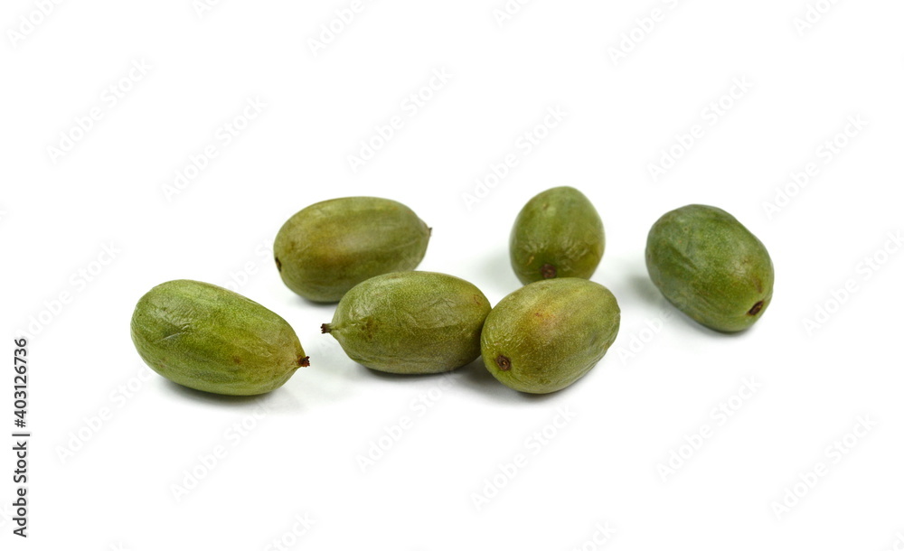 Mini kiwi baby fruit on white background. Kiwi berry isolated on white background. Mini kiwi baby fruit on white background. Kiwi berry isolated on white background.