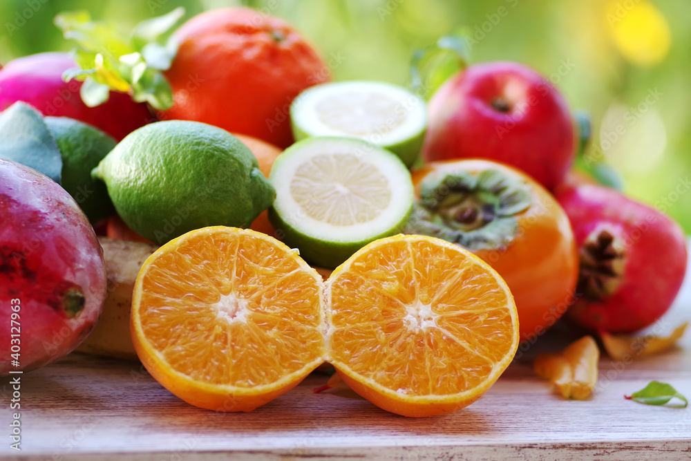 ripe mangoes, limes and sliced citric fruits. ripe mangoes, limes and sliced citric fruits.