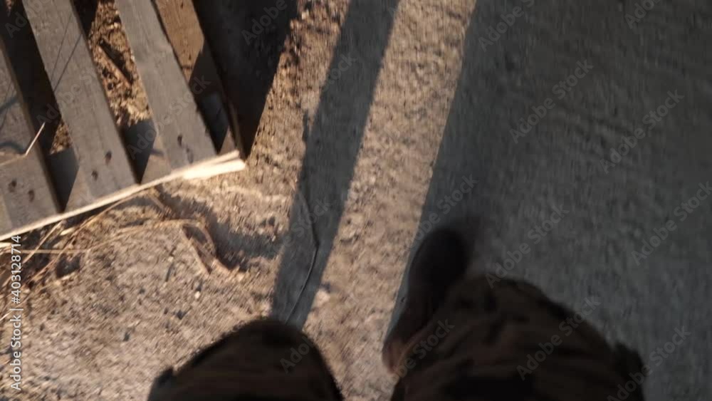 POV of a safari man walking through rough surface. Exploring the mysterious destination during sunset. POV of a safari man walking through rough surface. Exploring the mysterious destination during sunset.