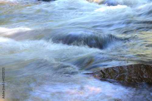 River in motion. nature background. Milky blue glacial water