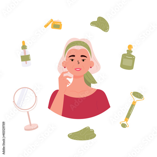 Old beautiful woman with bottle of face serum, facial gua sha stone, roller, mirror, cream. Facial yoga. Senior woman massaging her face. Anti-aging skin care method. Vector flat illustration. 