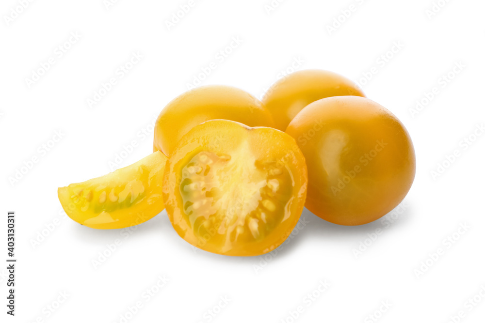 Cut ripe yellow tomatoes isolated on white