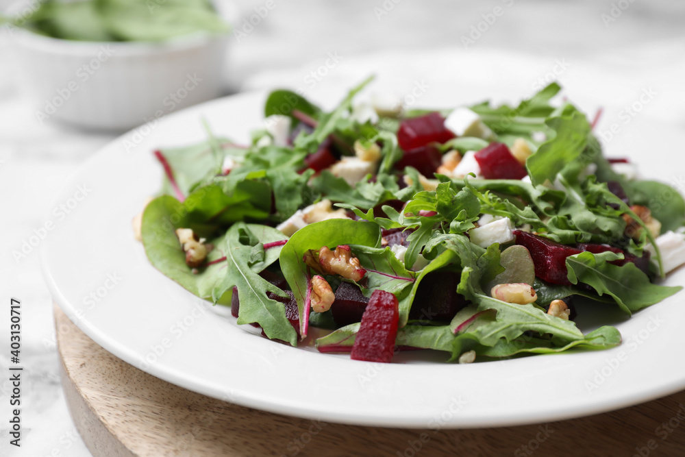 Delicious beet salad served on white table, closeup Delicious beet salad served on white table, closeup
