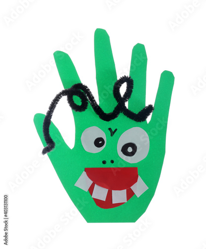 Funny green hand shaped monster isolated on white, top view. Halloween decoration