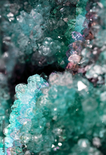 Beautiful blue mystic crystal magic Rhinestone gem stone. Iridescent natural geometric crystals.