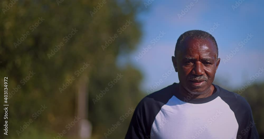 Senior african-american man running outdoors on park