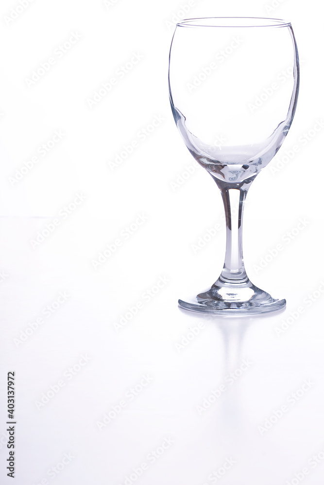 An empty wine glass on a white background An empty wine glass on a white background
