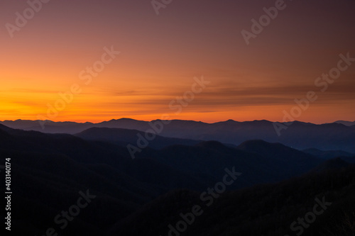 Mountain Ridges Emerge At Sunrise