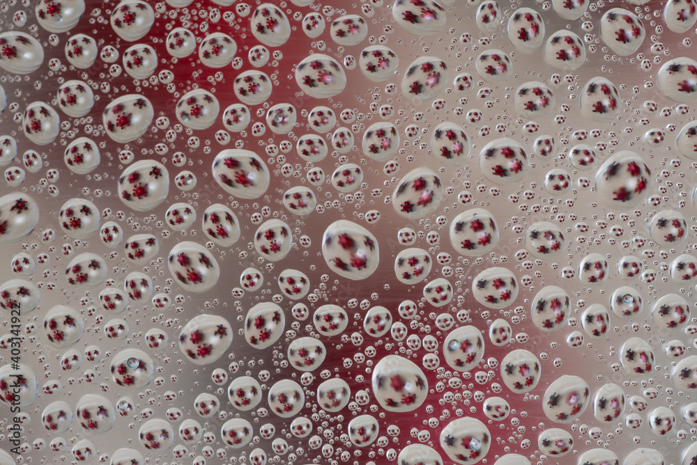 Drops with reflection of red corona virus model,Coronavirus Covid-19 outbreak,saliva that is expelled when sneezing