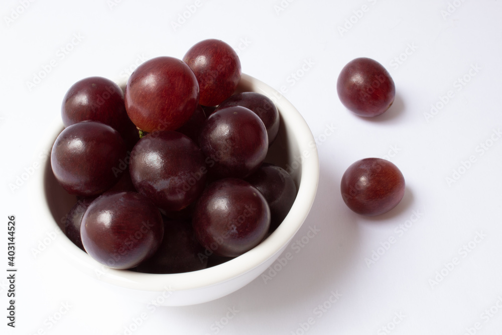 Bowl with grape berries isolated on white background Bowl with grape berries isolated on white background