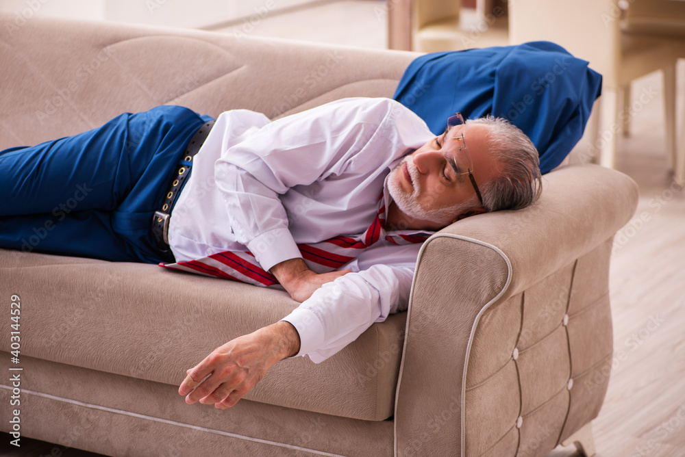 Old male boss employee coming home from work Old male boss employee coming home from work