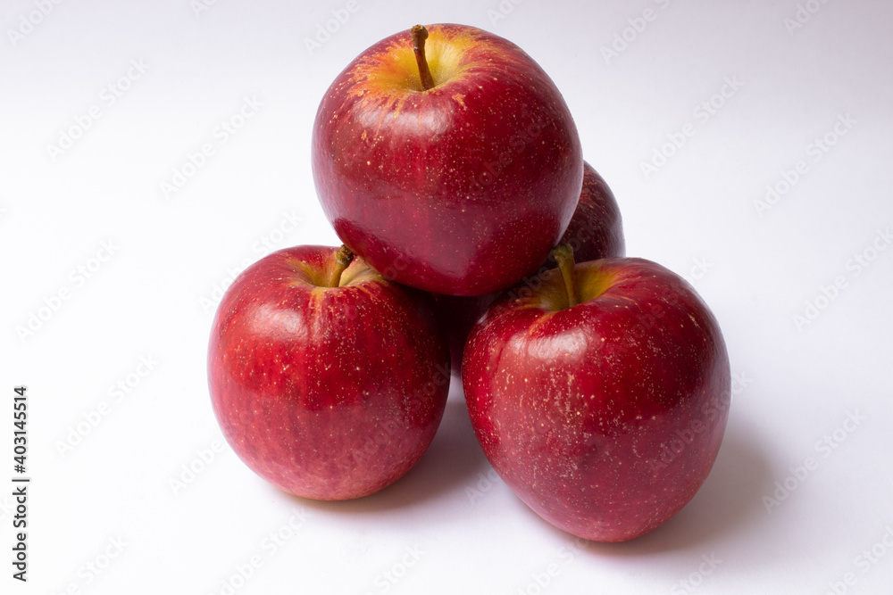 Pile of red apples isolated on white background