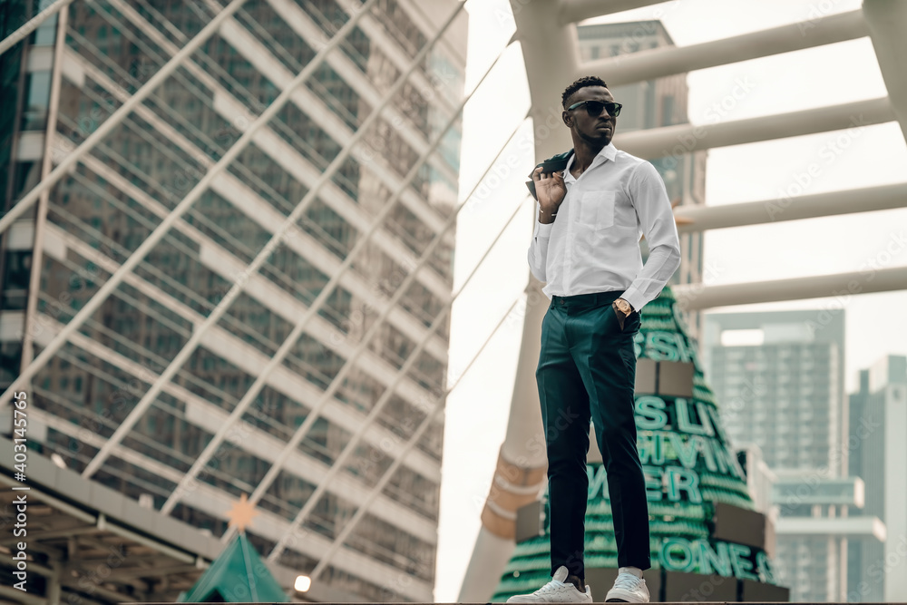 portrait of successful african businessman outdoor in modern city