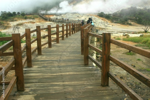 The newest tourist spot of the Kahyangan Bridge from the Sikidang Crater tourist attraction. Dieng Indonesia