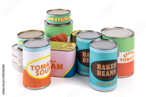 a collection of generic labelled food tins or cans, tomatoes, beans, tuna and soup isolated on white photo