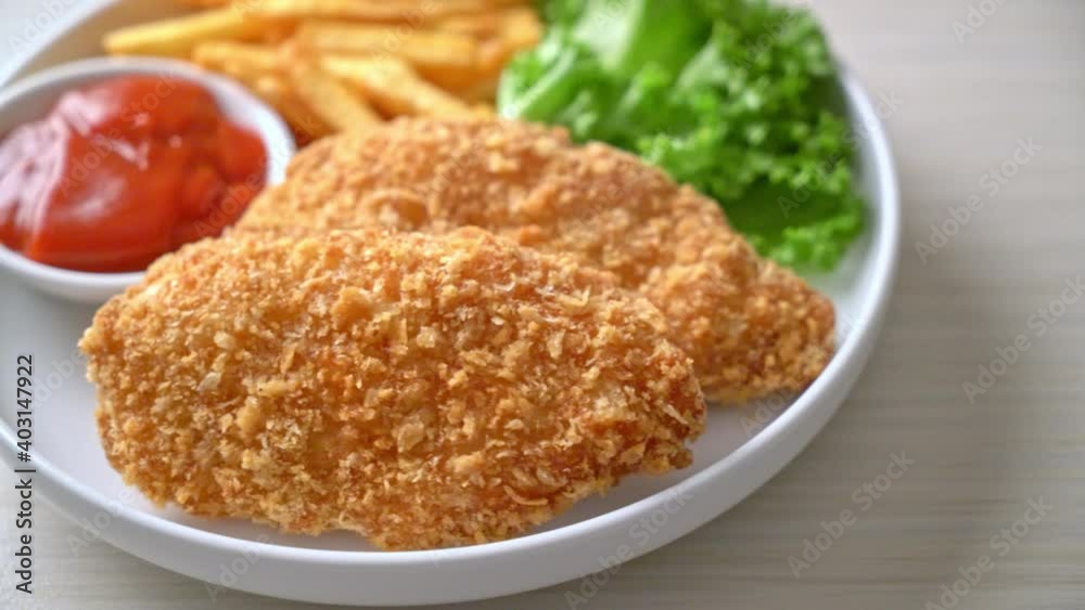 fried chicken breast fillet steak with French fries and ketchup fried chicken breast fillet steak with French fries and ketchup