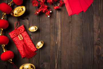 Chinese new year 2021 festival, Top view flat lay lunar new year or Happy Chinese new year decorations celebration with copy space on the wood background (Chinese character "fu" meaning fortune)