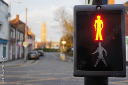 pedestrian crossing sign with soft focus urban background