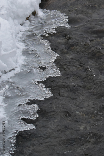 Ice forming patterns above a cold Alaska stream.