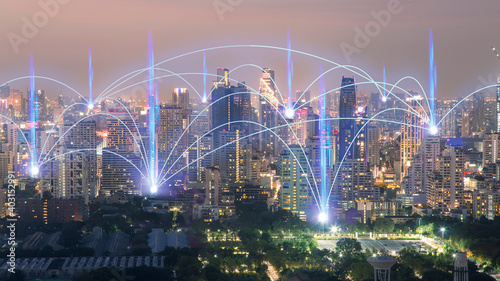 Smart city and internet communication, wireless communication network.City scape with connecting dots for networking.
