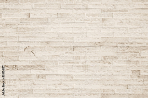 Empty Background of wide cream brick wall texture. Old brown brick wall concrete or stone pattern nature, wallpaper limestone abstract floor/Grid uneven interior rock. Home & office design backdrop.