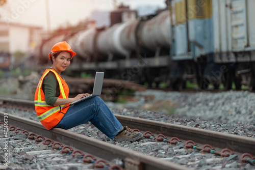 engineer sitting on railway inspection. construction worker Using laptop on railways. Engineer work on railway, rail, engineer, Infrastructure