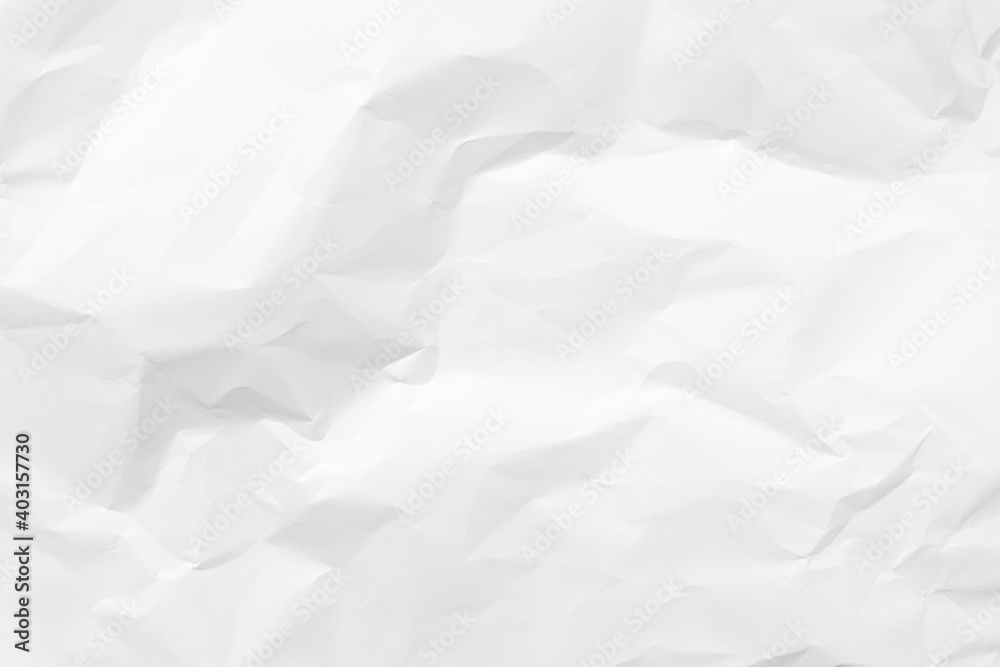 White crumpled paper texture background. Clean white paper. Top view. White crumpled paper texture background. Clean white paper. Top view.