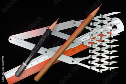Ten-point divider made of metal on black background
