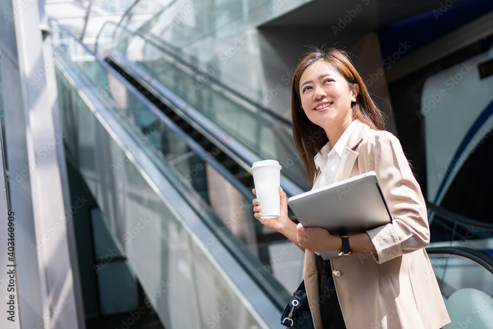 Beautiful business woman, she is going to work in the morning on the subway. Beautiful business woman, she is going to work in the morning on the subway.