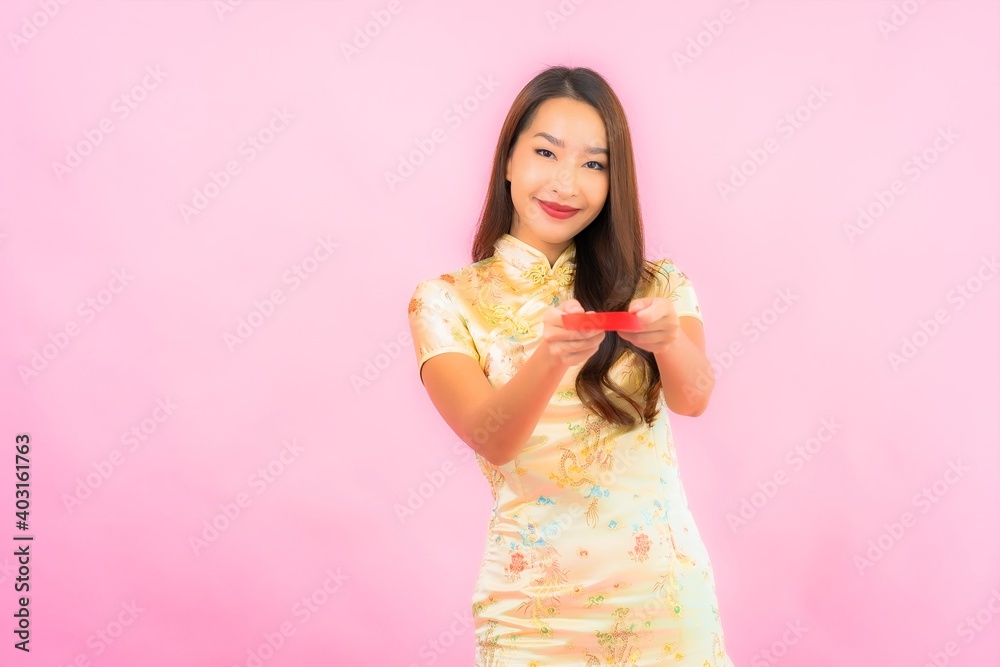 Portrait beautiful young asian woman with red envelopes in chinese new year concept Portrait beautiful young asian woman with red envelopes in chinese new year concept