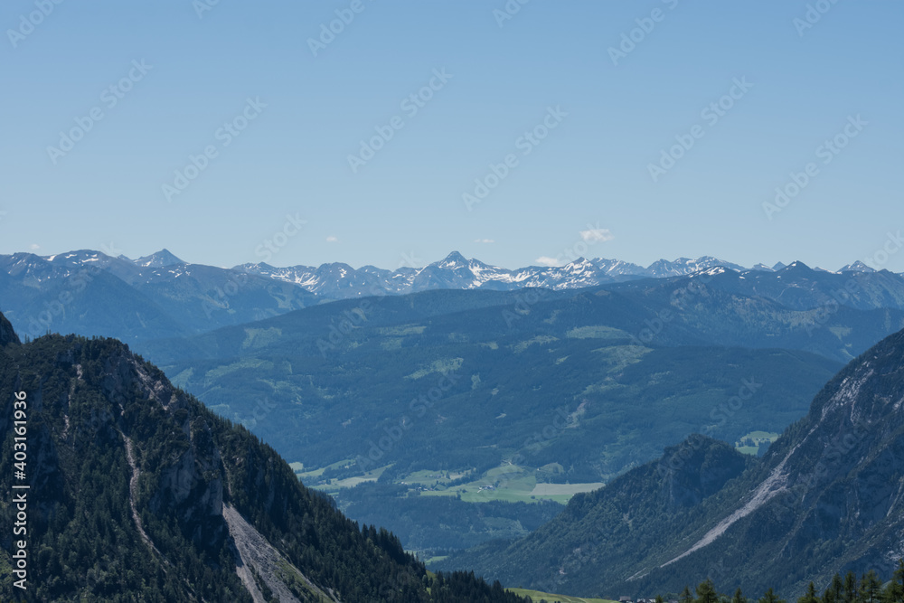 large mountain range with many peaks on the horizon while hiking