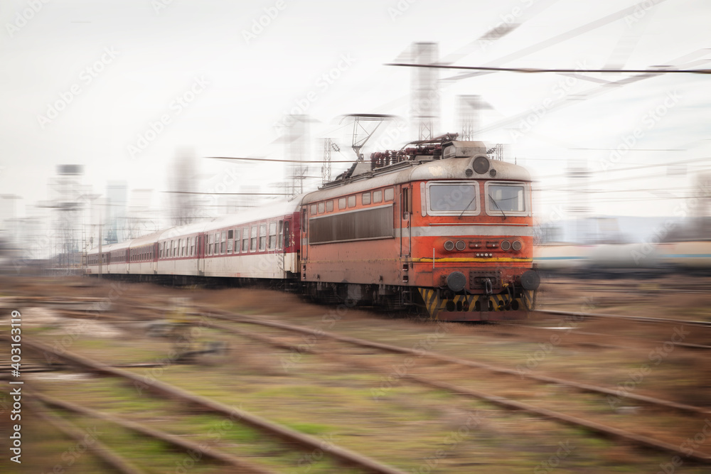 Old passenger train with motion blur effect. Railway transportation