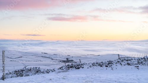 Winter scene at Pendle Hill around Sunrise.  There was a lot of low cloud and mist in the Pendle Valley at Nelson and Barrowford.   photo