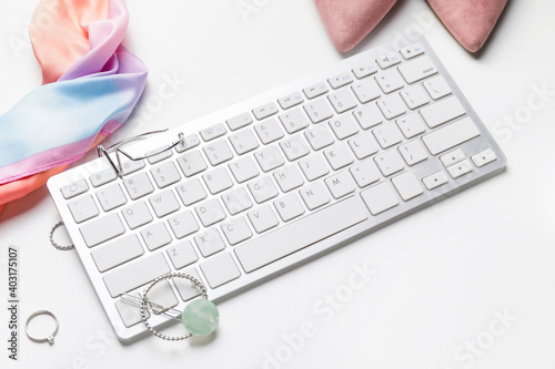 Computer keyboard and accessories on white background