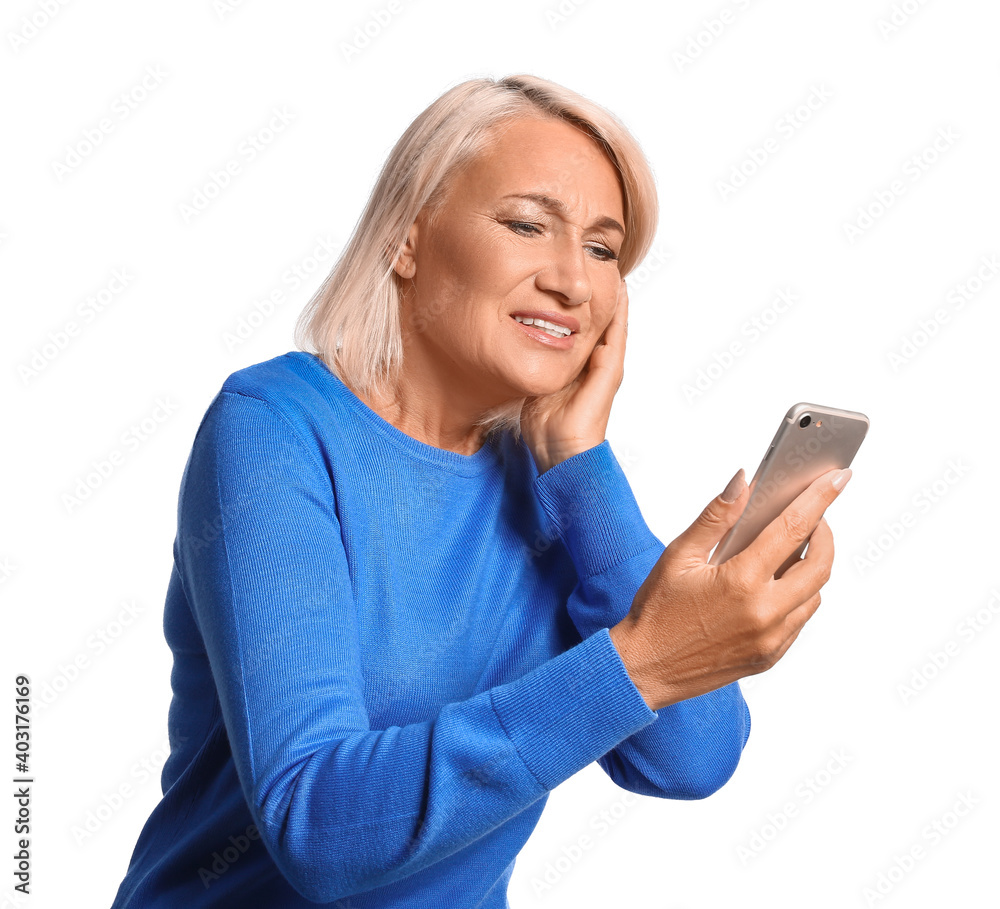 Stressed mature woman with mobile phone isolated on white background Stressed mature woman with mobile phone isolated on white background