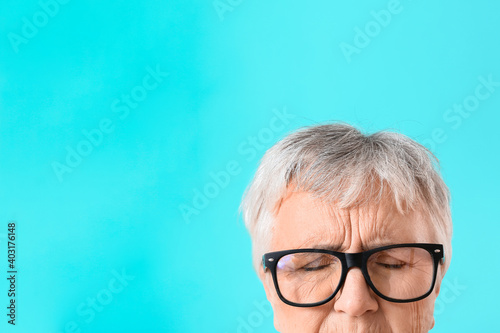 Stressed senior woman on co...