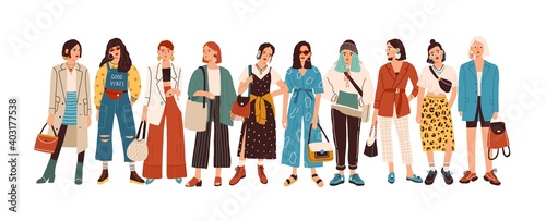 Group of fashionable women standing together vector flat illustration. Stylish female characters in modern casual, hipster clothes isolated on white. Beautiful ladies in elegant outfit