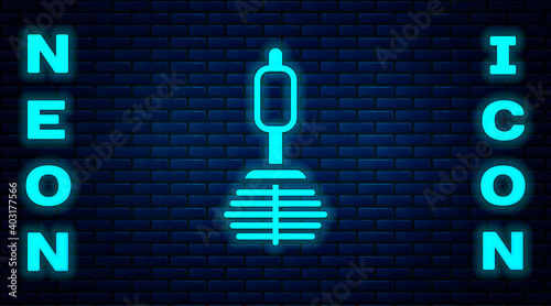 Glowing neon Toilet brush icon isolated on brick wall background. Vector.