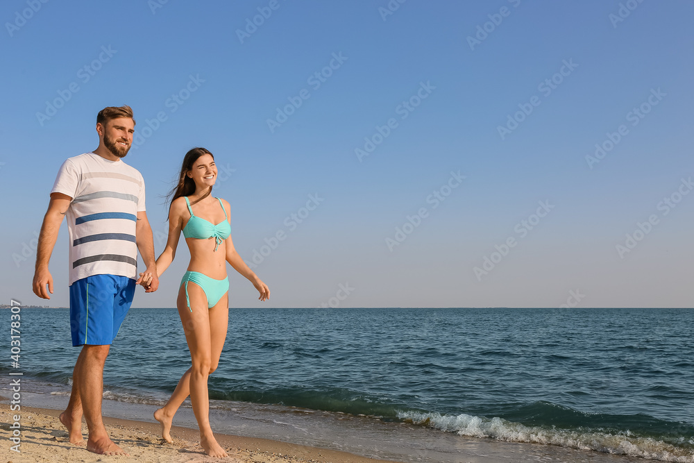 Happy young couple on sea beach