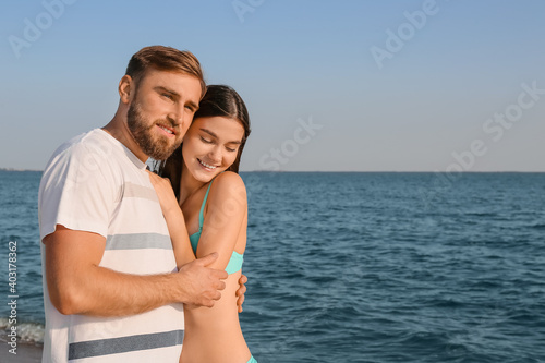 Happy young couple on sea beach