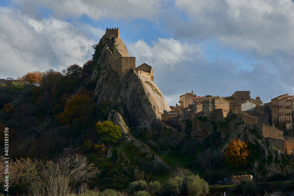 the village of Spelinga in the Province of Enna in Sicily with its medieval castle in a beautiful autumn-colored day