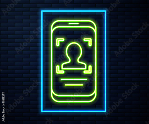 Glowing neon line Mobile phone and face recognition icon isolated on brick wall background. Face identification scanner icon. Facial id. Cyber security. Vector.