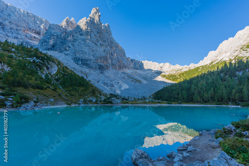 colorful Sorapis lake in italian Dolomites in morning light photo