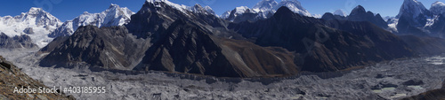 Panorama of Ngozumpa glacier (longest Himalayan glacier) with Everest, cho la, and lobuche in the background. Stone covered glacier. 