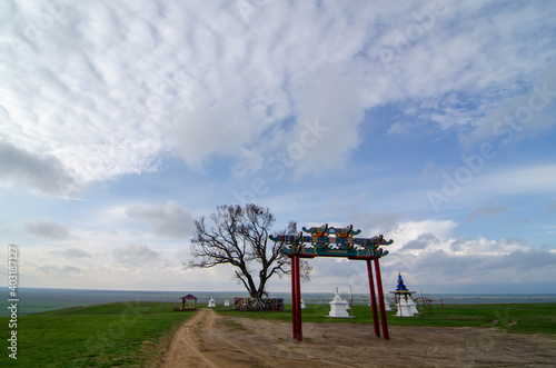 Pagoda and ritual drum and stupa with Buddhist symbols. Location Republic of Kalmykia