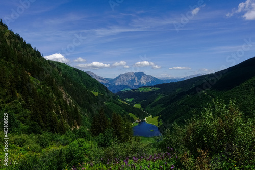 deep blue mountain lake from above while hiking