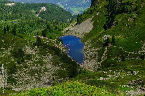 Fototapeta Naklejka Na Ścianę i Meble -  blue mountain lake in the green and rocky mountains