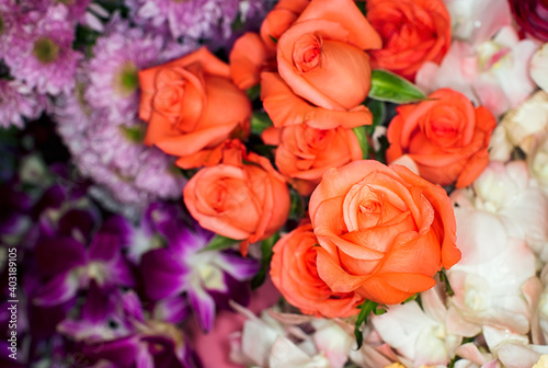 Close-up of a mixed bouquet of roses summer flowers background.