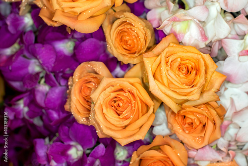 Close-up of a mixed bouquet of roses summer flowers background.