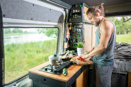 Young man living in a camper van